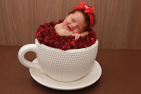 white ceramic mug and saucer with baby sleeping thumbnail