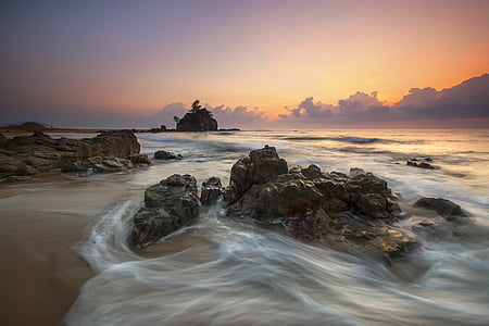 timelapse photography of rock and wave thumbnail