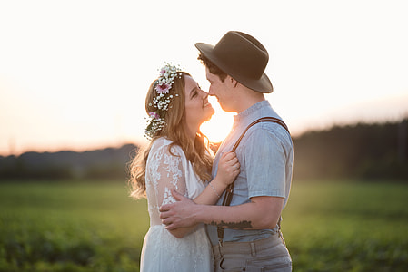 couple about to kiss near grass field thumbnail