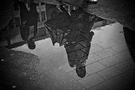two women's walking next to grey building during daytime thumbnail