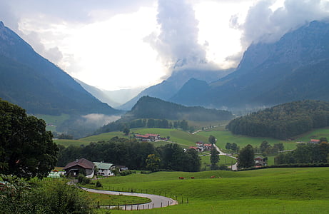 landscape photograph of village near body of water thumbnail