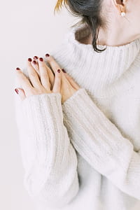 Woman Wearing Turtleneck Sweater in White Surface thumbnail