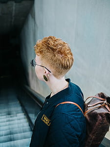 person wearing sunglasses facing on staircase thumbnail