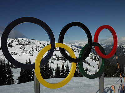 Olympics Symbol signage near pine trees thumbnail