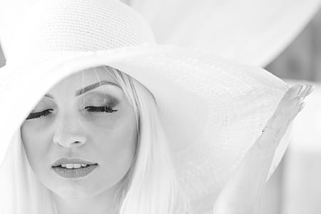 grayscale photo of woman wearing sun hat thumbnail
