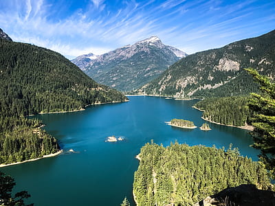 mountains beside lake at daytime thumbnail