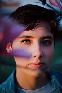 closeup photography of woman wearing blue top thumbnail
