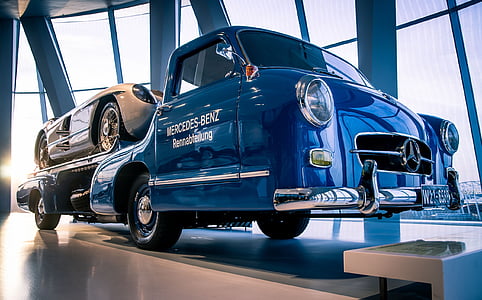 blue Mercedes-Benz vehicle inside showroom thumbnail