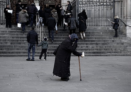 woman walking on street using cane thumbnail