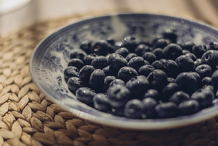 selective focus photography of round black seeds on white ceramic saucer thumbnail