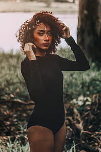 woman standing near tree thumbnail