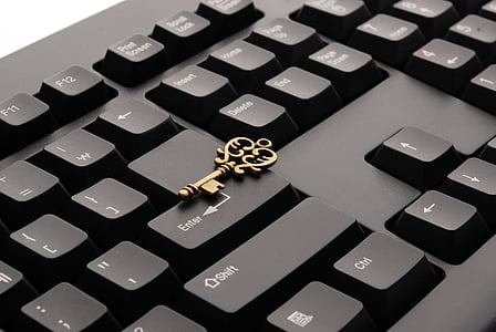brass skeleton key on computer keyboard thumbnail
