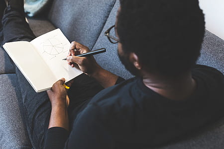 man, person, notebook, pen thumbnail