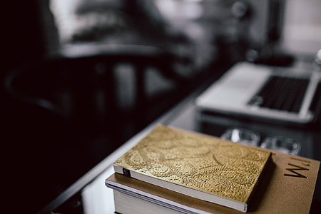 Organized desk with laptop and journals thumbnail