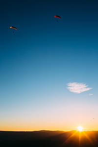 two person in paragliding during golden hour thumbnail