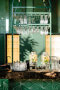 rack of wine glass and jars on table thumbnail