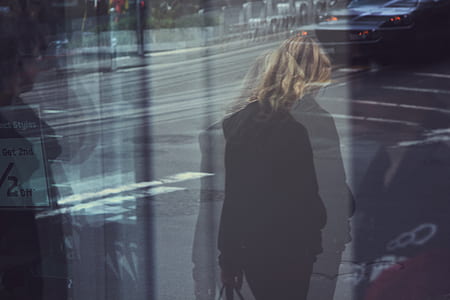 woman walking beside road thumbnail