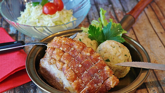 crispy pork skin and mashed potato served on stainless steel bowl thumbnail