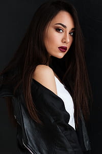 woman wears black jacket and white sleeveless shirt thumbnail