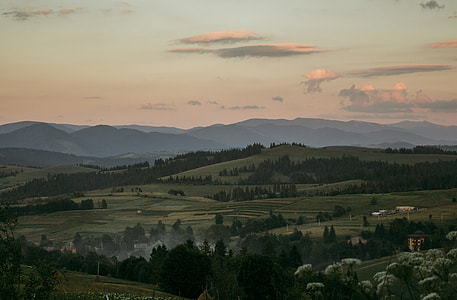 photo of mountain under white sky during daytime thumbnail
