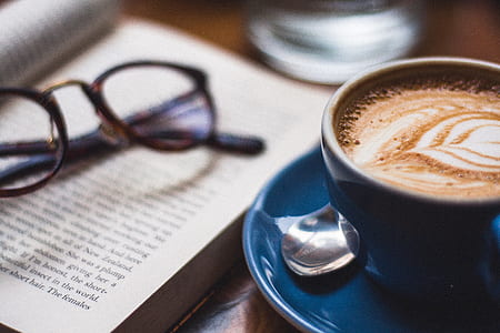latte coffee beside sunglasses thumbnail