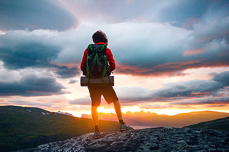 person standing on gray rock thumbnail