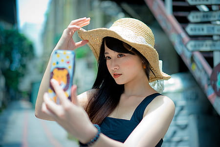 Woman Wearing Brown Summer Hat thumbnail