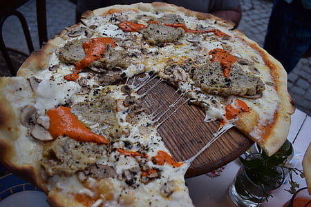 pizza on wooden table thumbnail