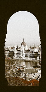 white concrete structure beside body of water thumbnail