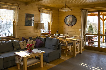 gray sofa beside brown wooden center table thumbnail