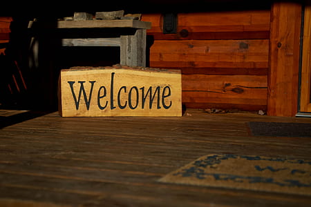 brown wooden Welcome signage on wooden surface thumbnail