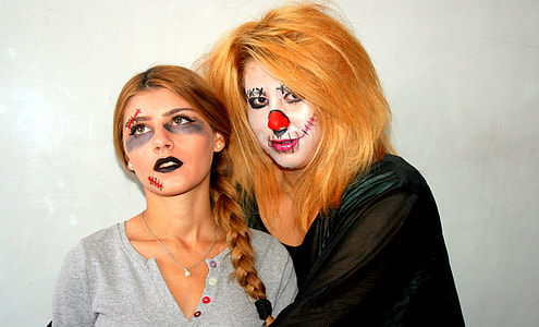 two women with makeups on their faces thumbnail