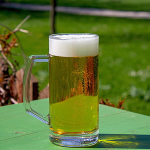 clear drinking mug filled with brown liquid thumbnail