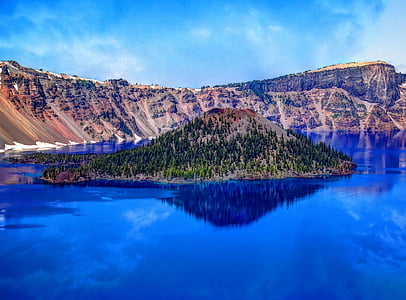 island surrounded water near mountain thumbnail