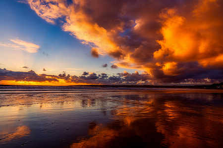 time lapse photography of clouds over body of water thumbnail