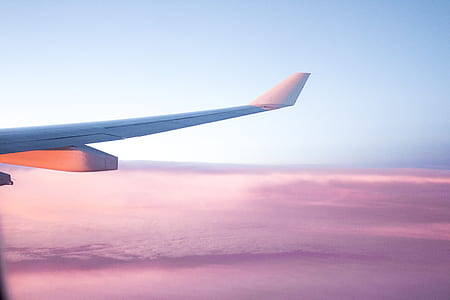 airplane travelling above white clouds thumbnail
