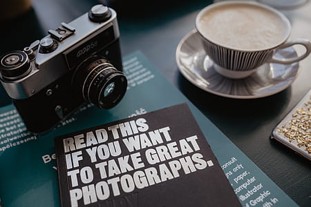 Old analog camera and photography book thumbnail