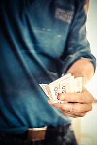 person holding banknotes thumbnail