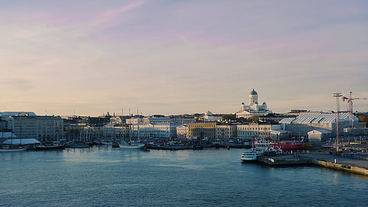 photo of city buildings near body of water thumbnail