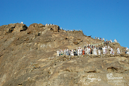 people standing on mountain during daytime thumbnail