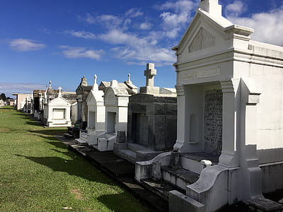 concrete tombstones on cemetery during daytime thumbnail