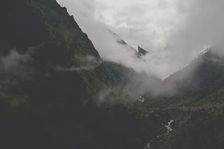 high-angle photography of fog covering portion of mountain thumbnail