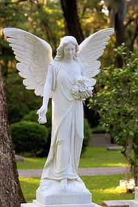 female angel statue in garden thumbnail