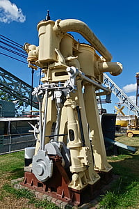 beige industrial equipment on green grass thumbnail