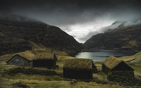huts on hill photo thumbnail