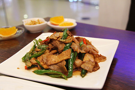 brown meat dish on top of ceramic plate thumbnail