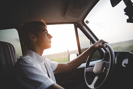 man driving a vehicle during daytime thumbnail