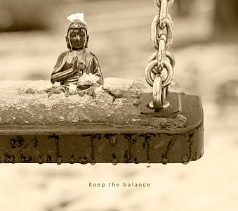 Gautama Buddha figurine on swing thumbnail