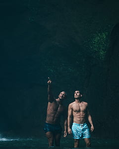 two man in cave looking outside thumbnail