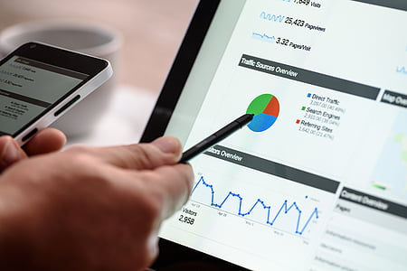 person pointing at pie chart on monitor screen thumbnail